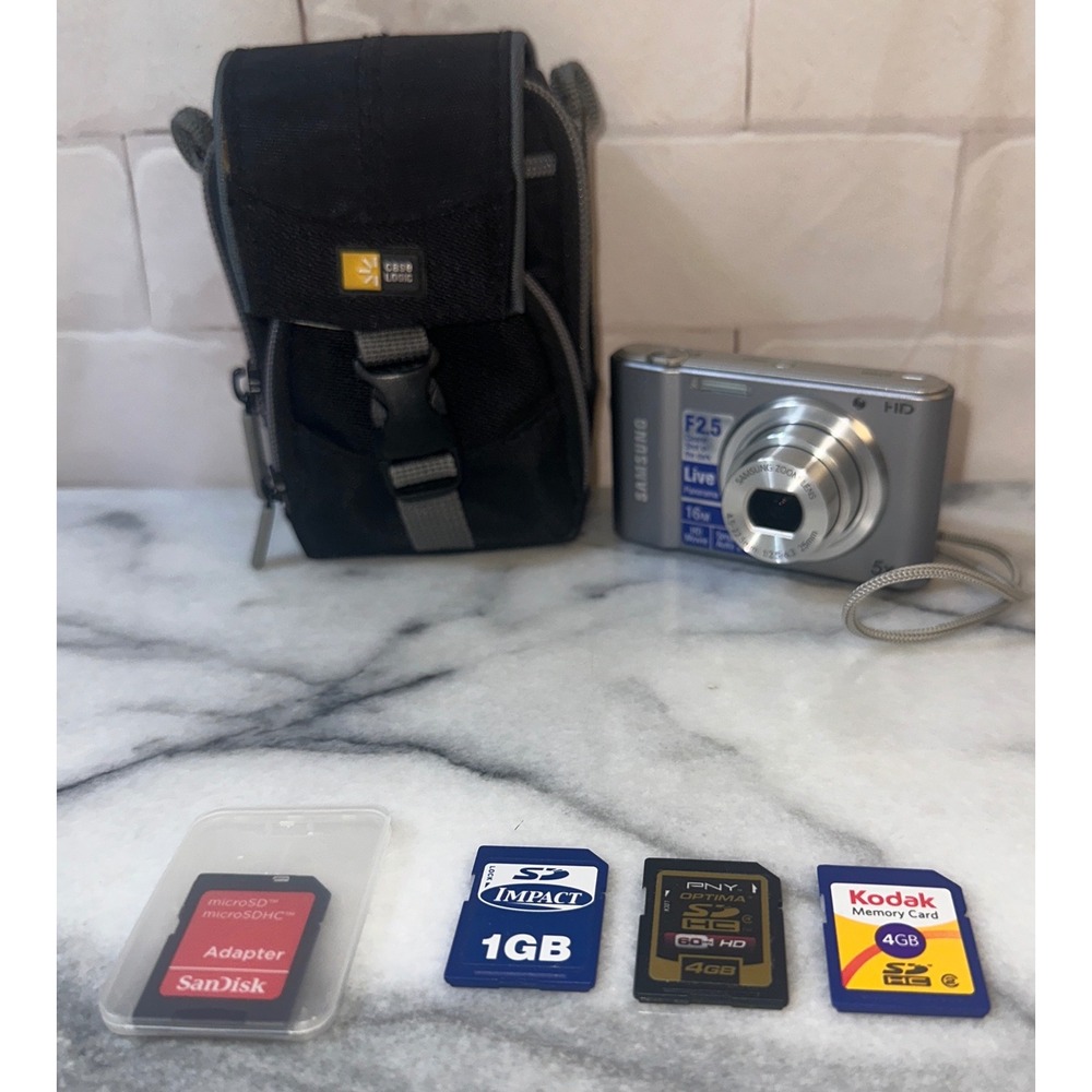 Samsung ST66 16.1MP Digital Camera Silver 5x Zoom HD Bundle Case Logic SD Cards